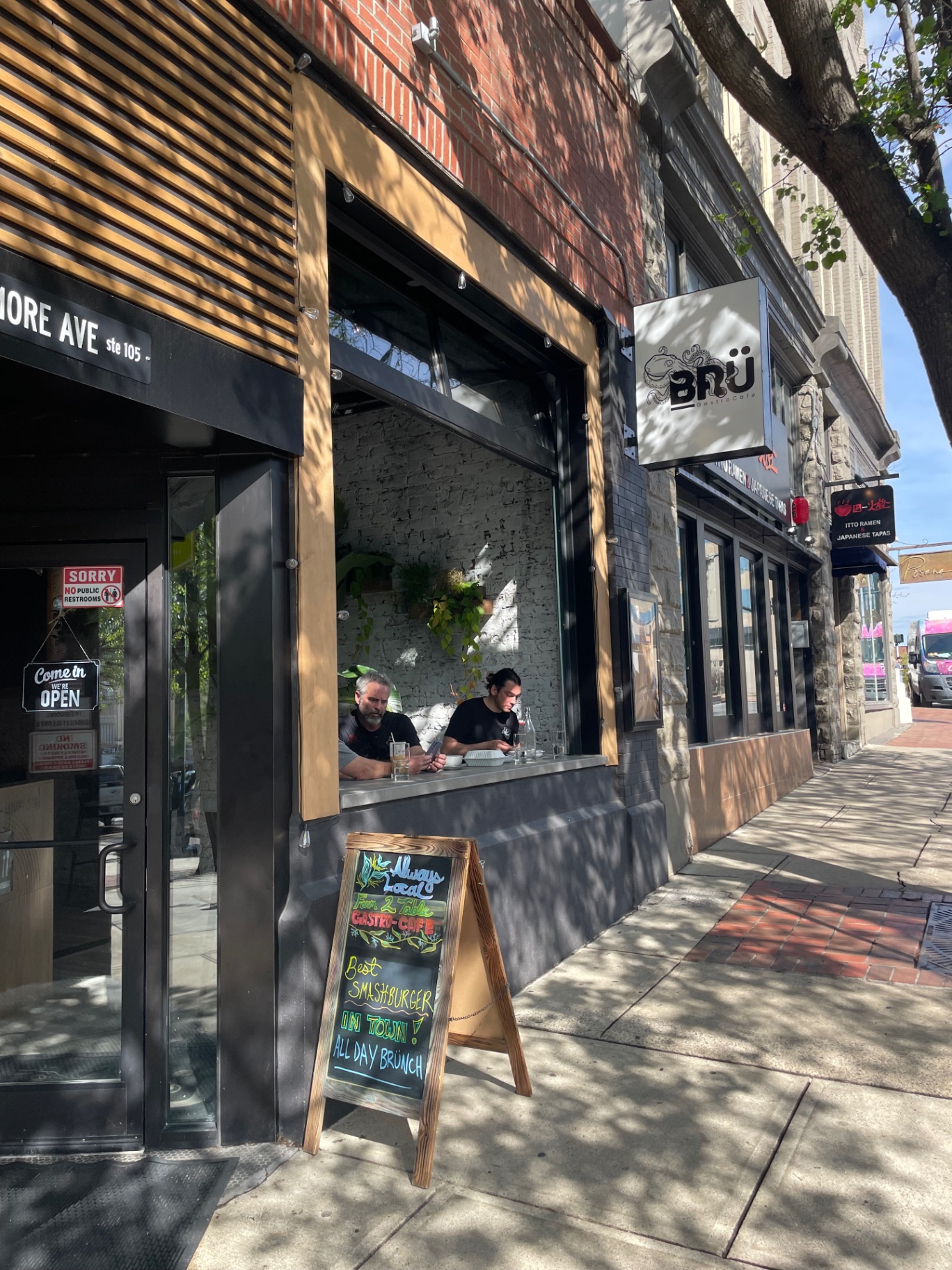 Brü GastroCafe storefront at 5 Biltmore Ave with open window seating in downtown Asheville